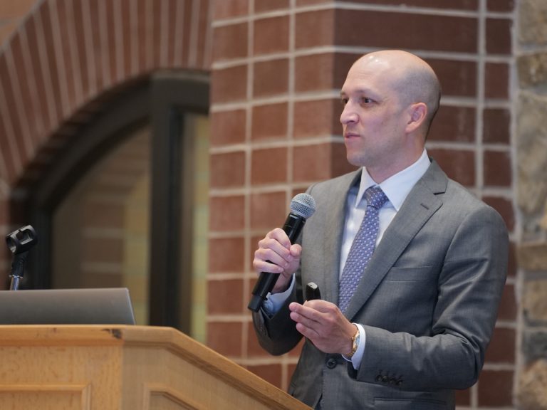 Jimmy Atkinson speaking at the 2024 Family Office Real Estate Institute Conference at the University of Denver